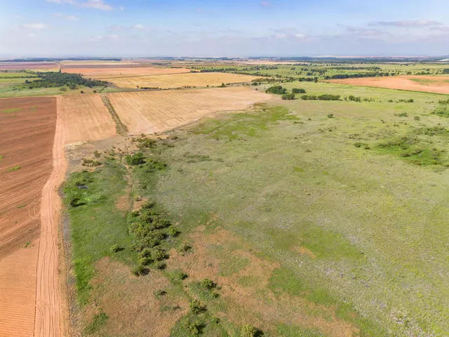 a view of a field with an outdoor space