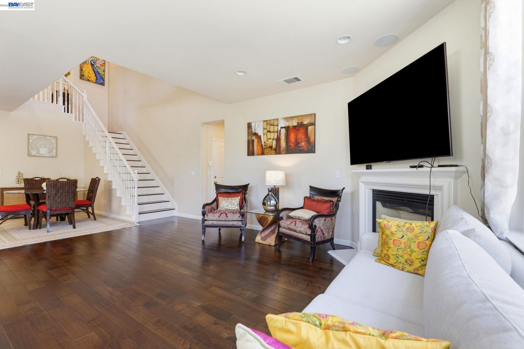 5029 Queensbury Way San Ramon, CA 94582 - Photo 8 of 58 a living room with furniture and a flat screen tv