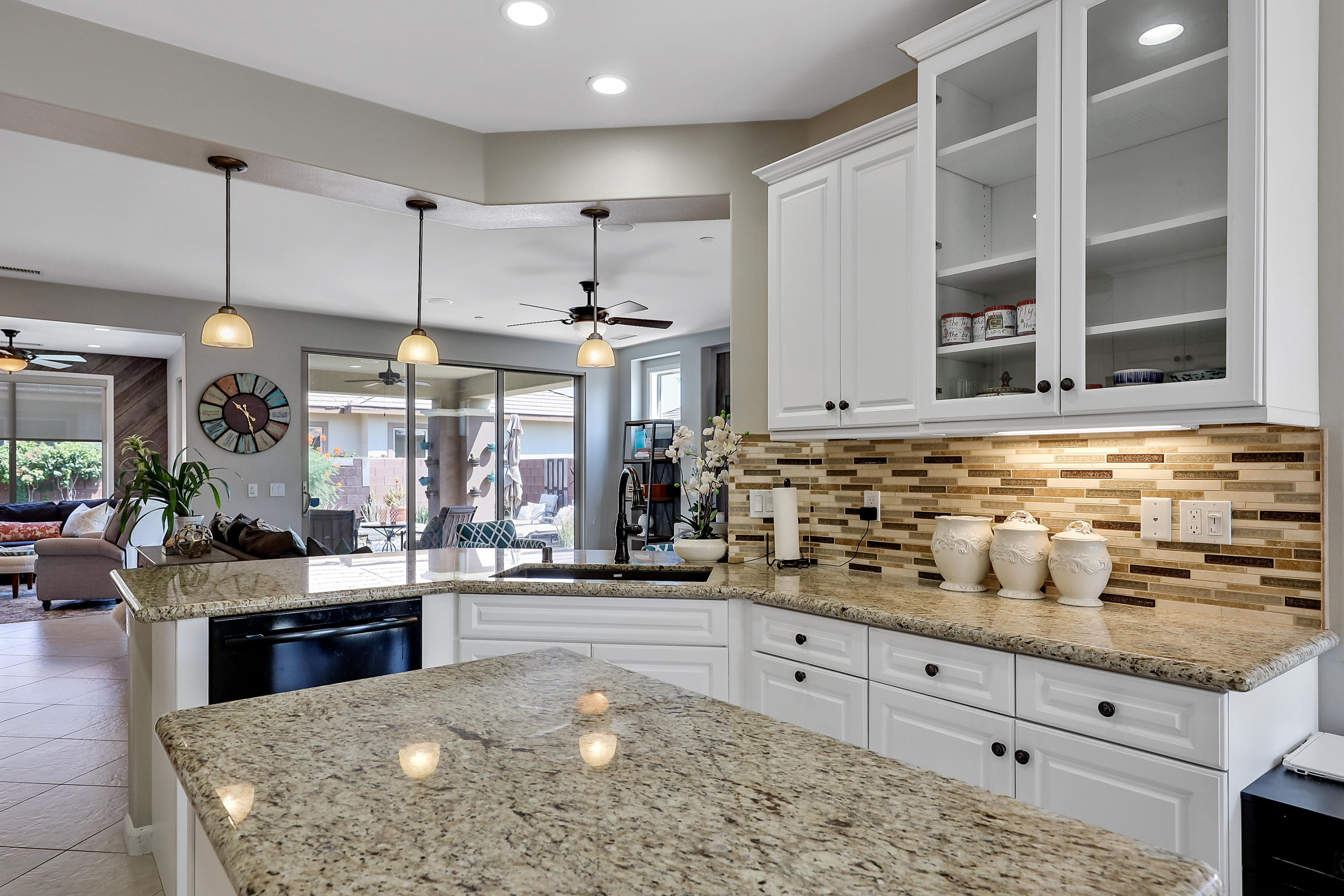 82782 Kingsboro Lane Indio, CA 92201 - Photo 14 of 39 a kitchen with stainless steel appliances kitchen island granite countertop a stove and cabinets