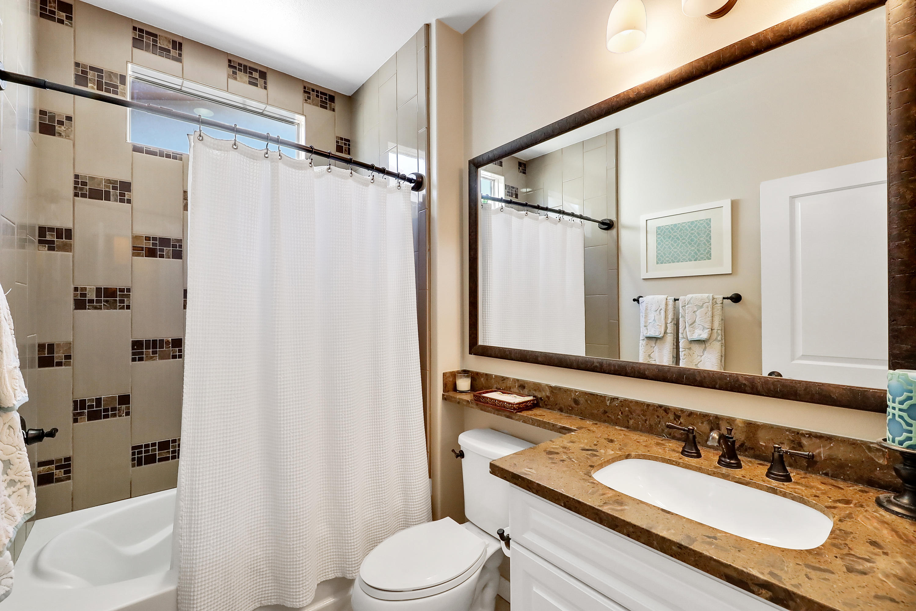 82782 Kingsboro Lane Indio, CA 92201 - Photo 17 of 39 a bathroom with a granite countertop sink toilet and shower