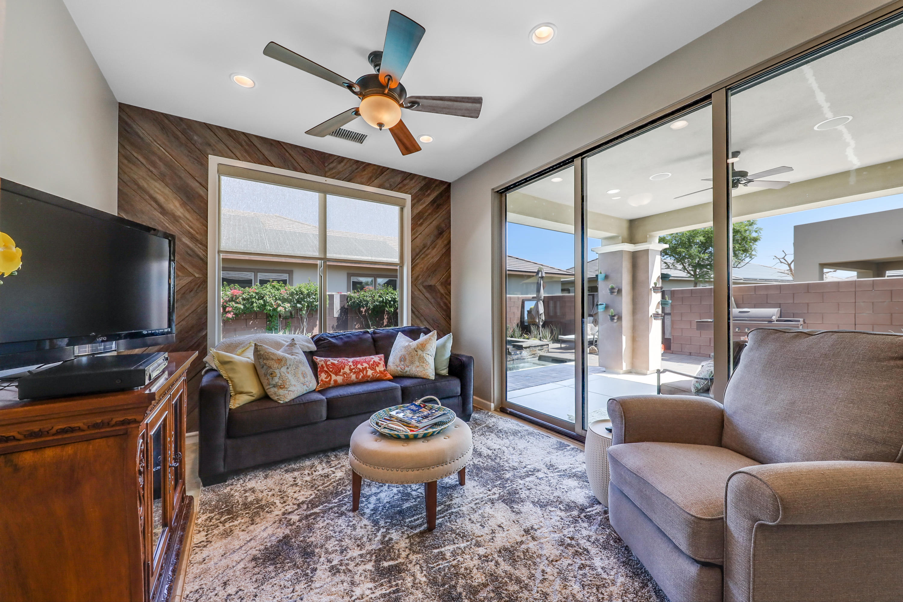 82782 Kingsboro Lane Indio, CA 92201 - Photo 18 of 39 a living room with furniture a flat screen tv and a large window