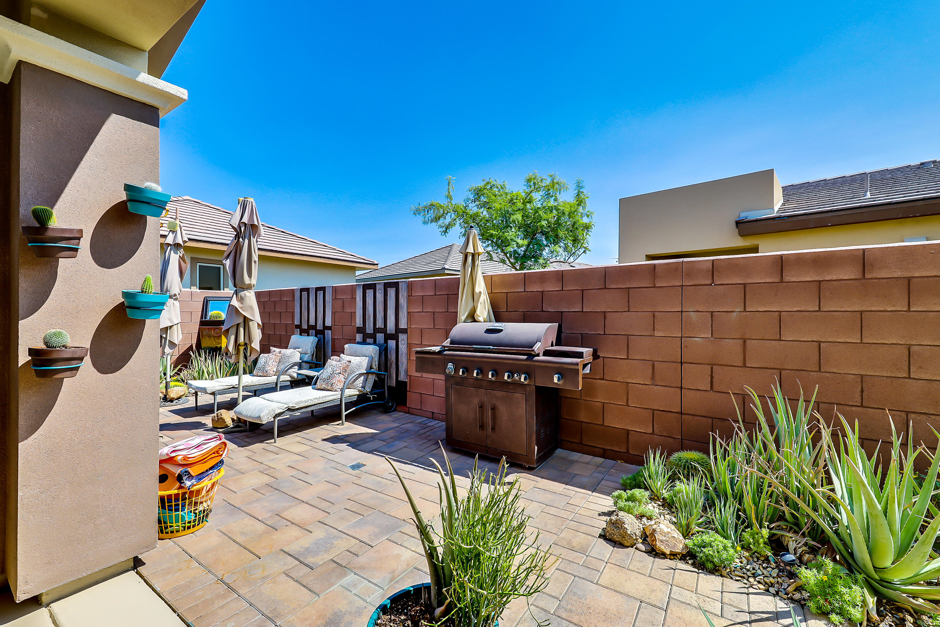 82782 Kingsboro Lane Indio, CA 92201 - Photo 24 of 39 a view of a patio with couches and potted plants