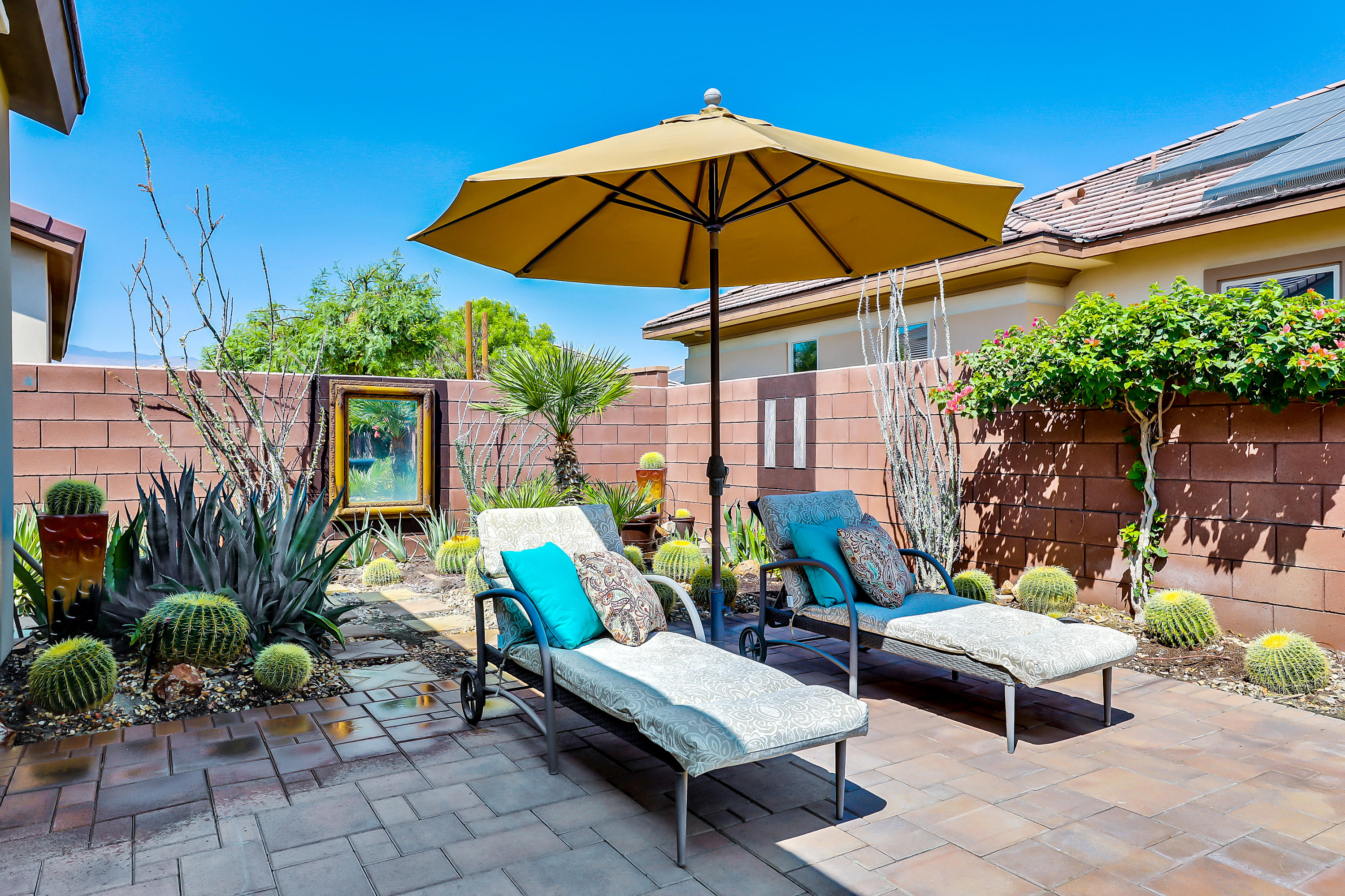 82782 Kingsboro Lane Indio, CA 92201 - Photo 28 of 39 a view of a backyard with sitting area and furniture