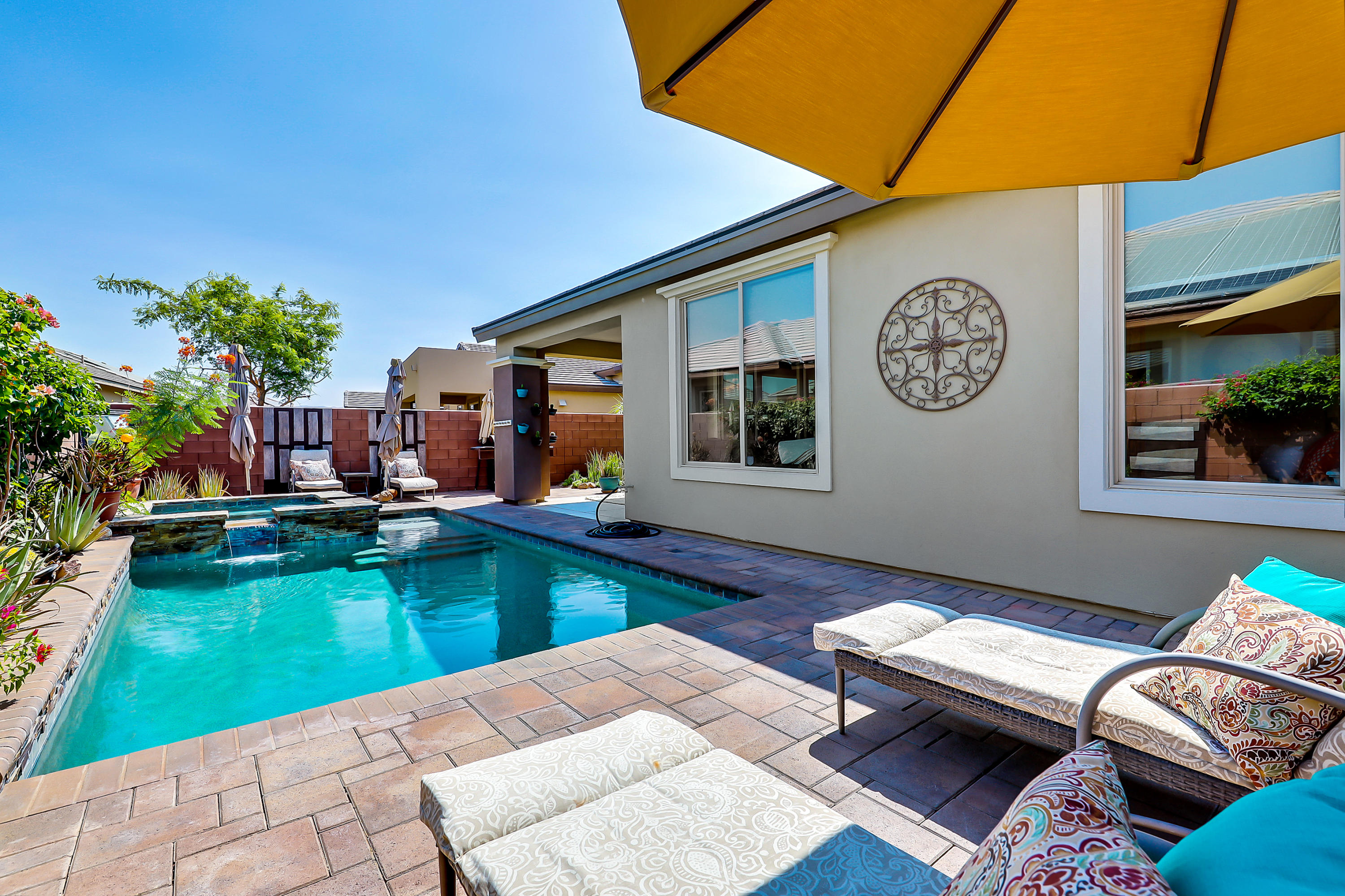82782 Kingsboro Lane Indio, CA 92201 - Photo 29 of 39 a view of a patio with swimming pool table and chairs