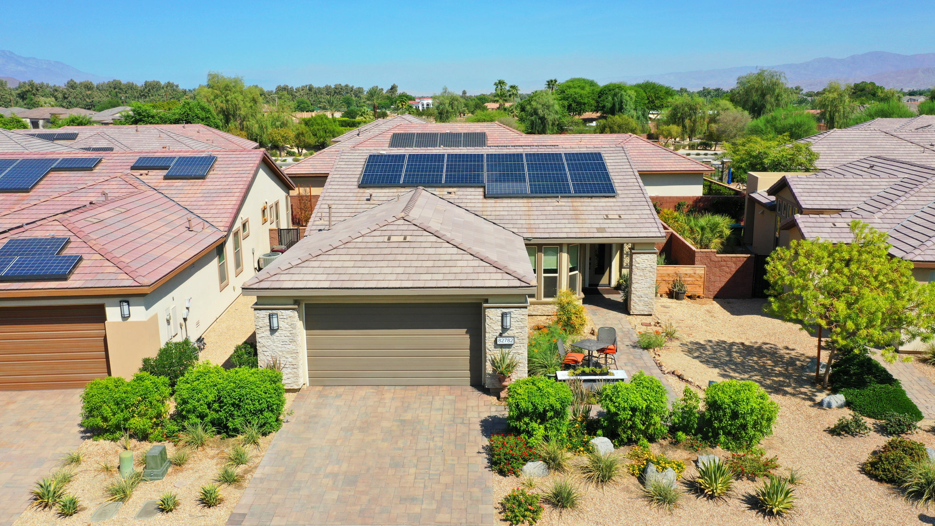 82782 Kingsboro Lane Indio, CA 92201 - Photo 31 of 39 an aerial view of a house with yard and parking