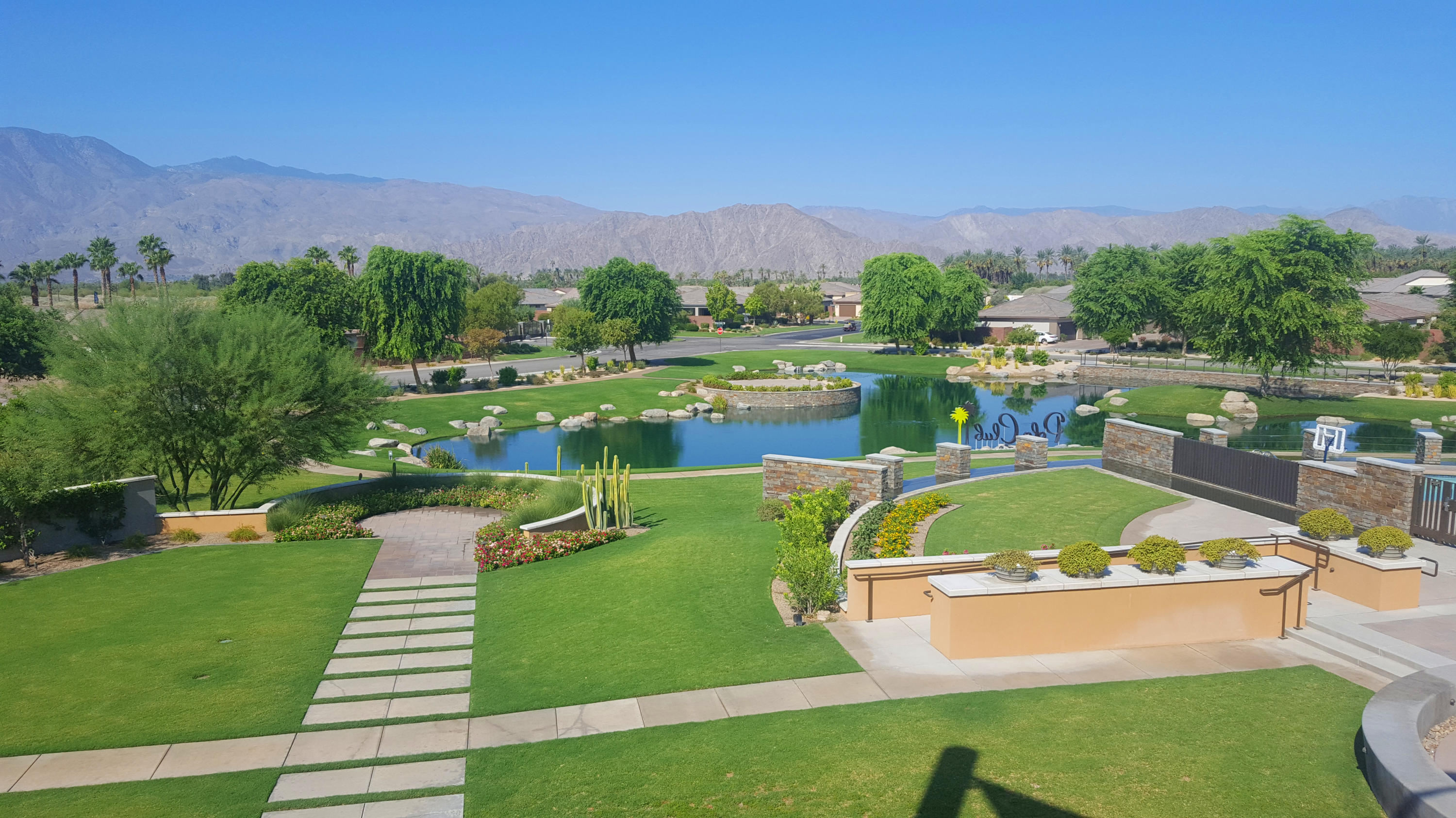 82782 Kingsboro Lane Indio, CA 92201 - Photo 35 of 39 a view of a lake with a mountain in the background