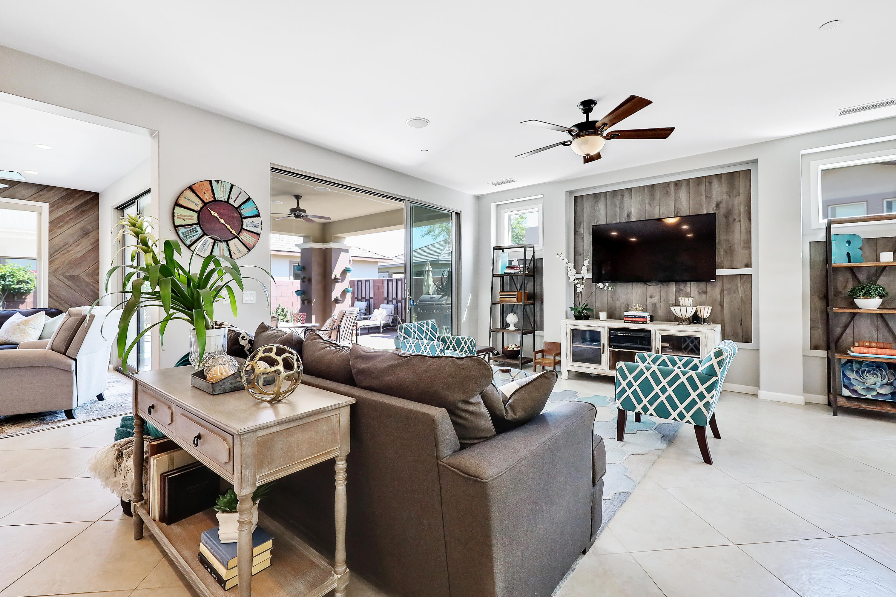 82782 Kingsboro Lane Indio, CA 92201 - Photo 5 of 39 a living room with furniture a flat screen tv and a window