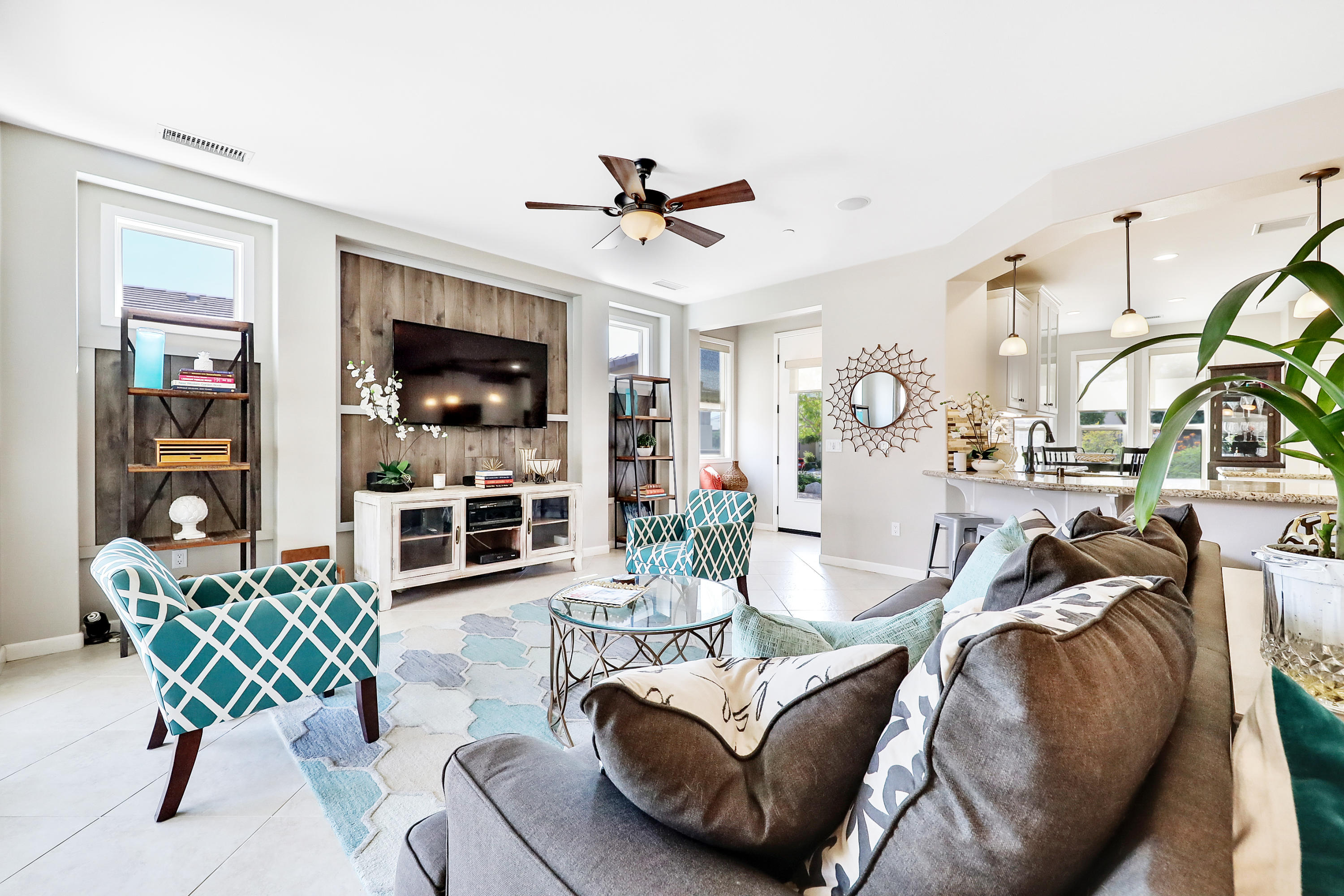 82782 Kingsboro Lane Indio, CA 92201 - Photo 8 of 39 a living room with furniture a flat screen tv and a floor to ceiling window