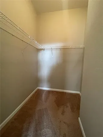 a view of a house with a yard potted plants