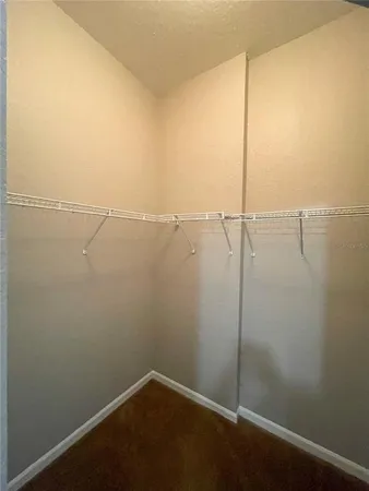 an empty room with a empty space and a ceiling fan