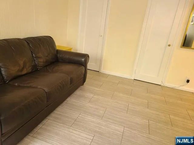 a blue bed sitting in a bedroom next to a bathroom