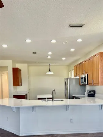a large kitchen with stainless steel appliances