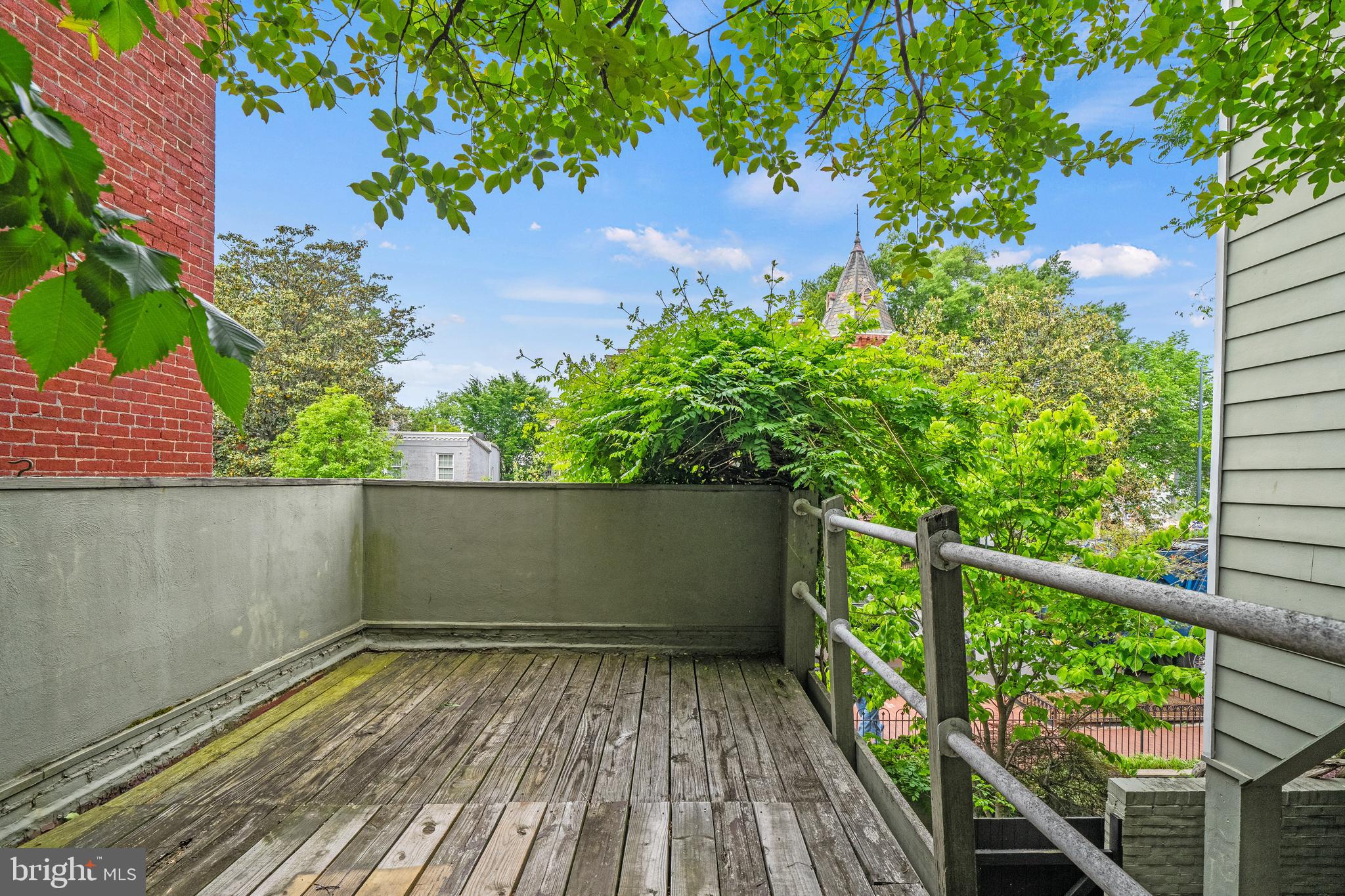400 7th Street Southeast Washington, DC 20003 - Photo 7 of 23 a view of balcony with wooden floor and fence