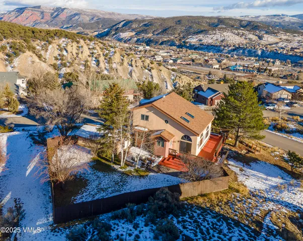 an aerial view of residential houses with outdoor space
