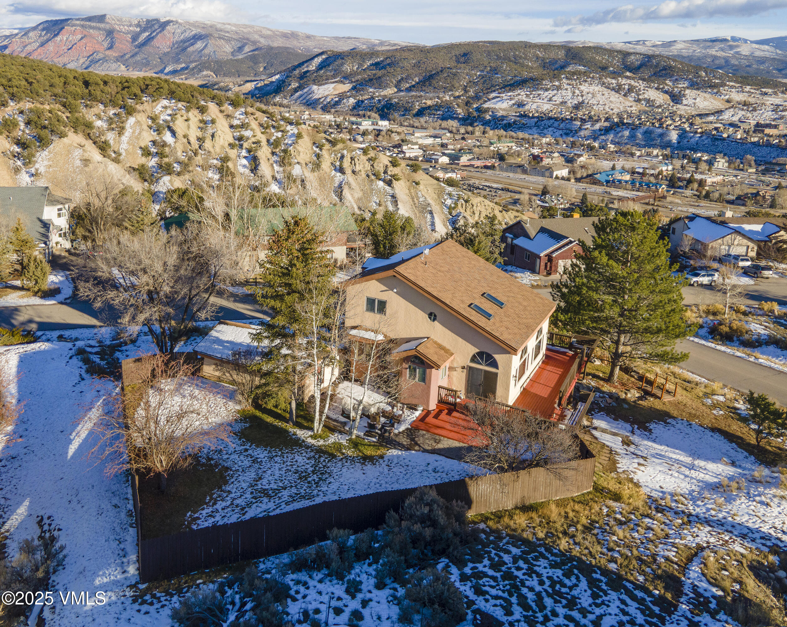 an aerial view of residential houses with outdoor space