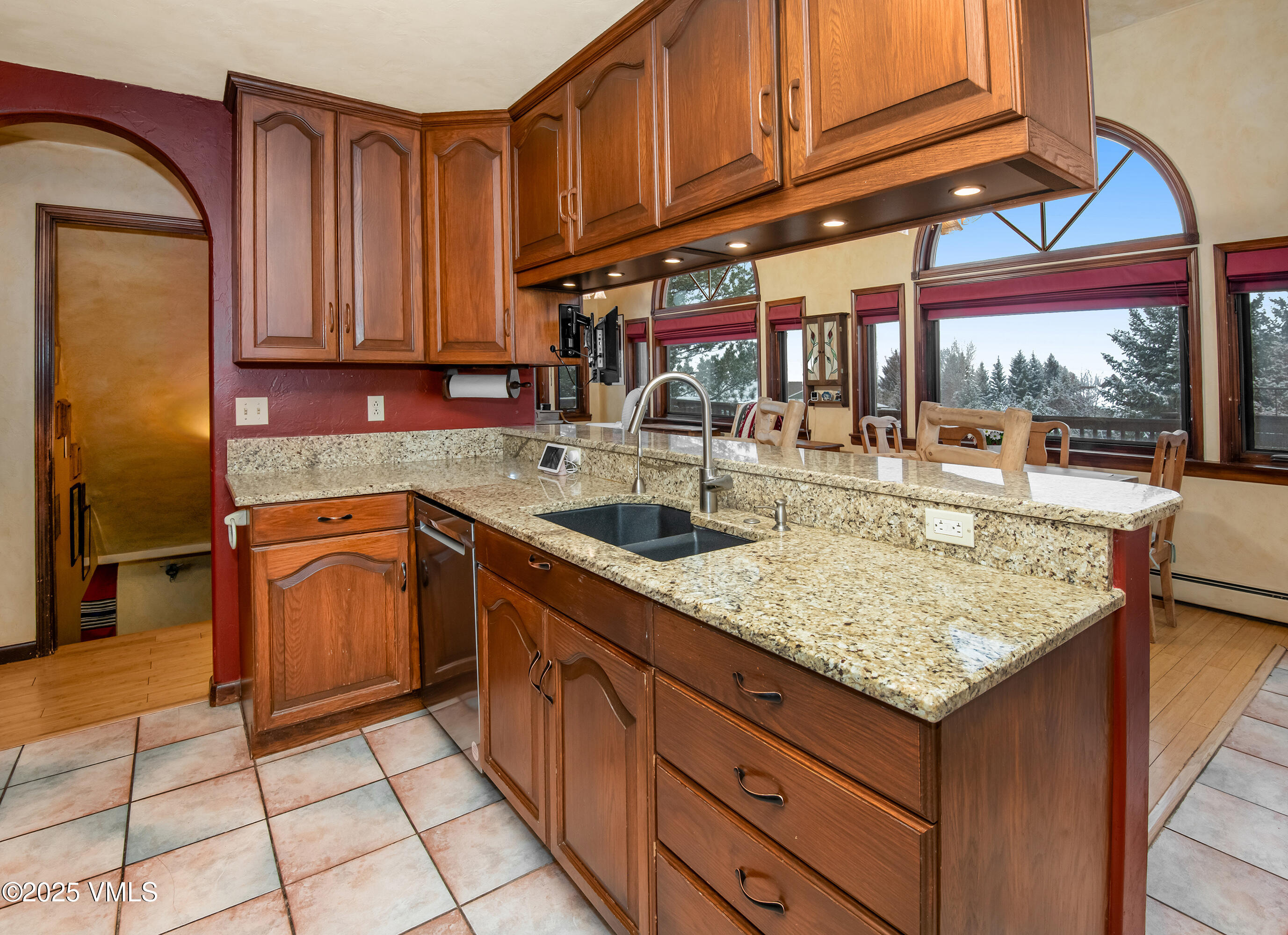 13 Pinion Lane Eagle, CO 81631 - Photo 11 of 60 a kitchen with stainless steel appliances granite countertop a sink and cabinets
