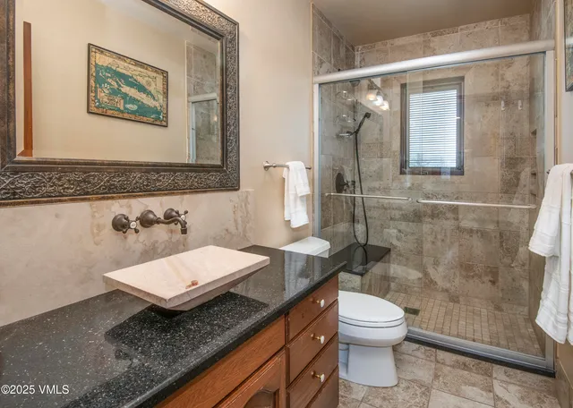a bathroom with a tub and shower