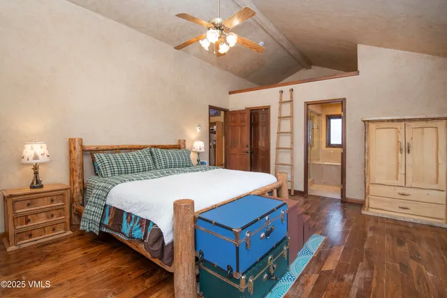 a bed room with furniture and a baby crib