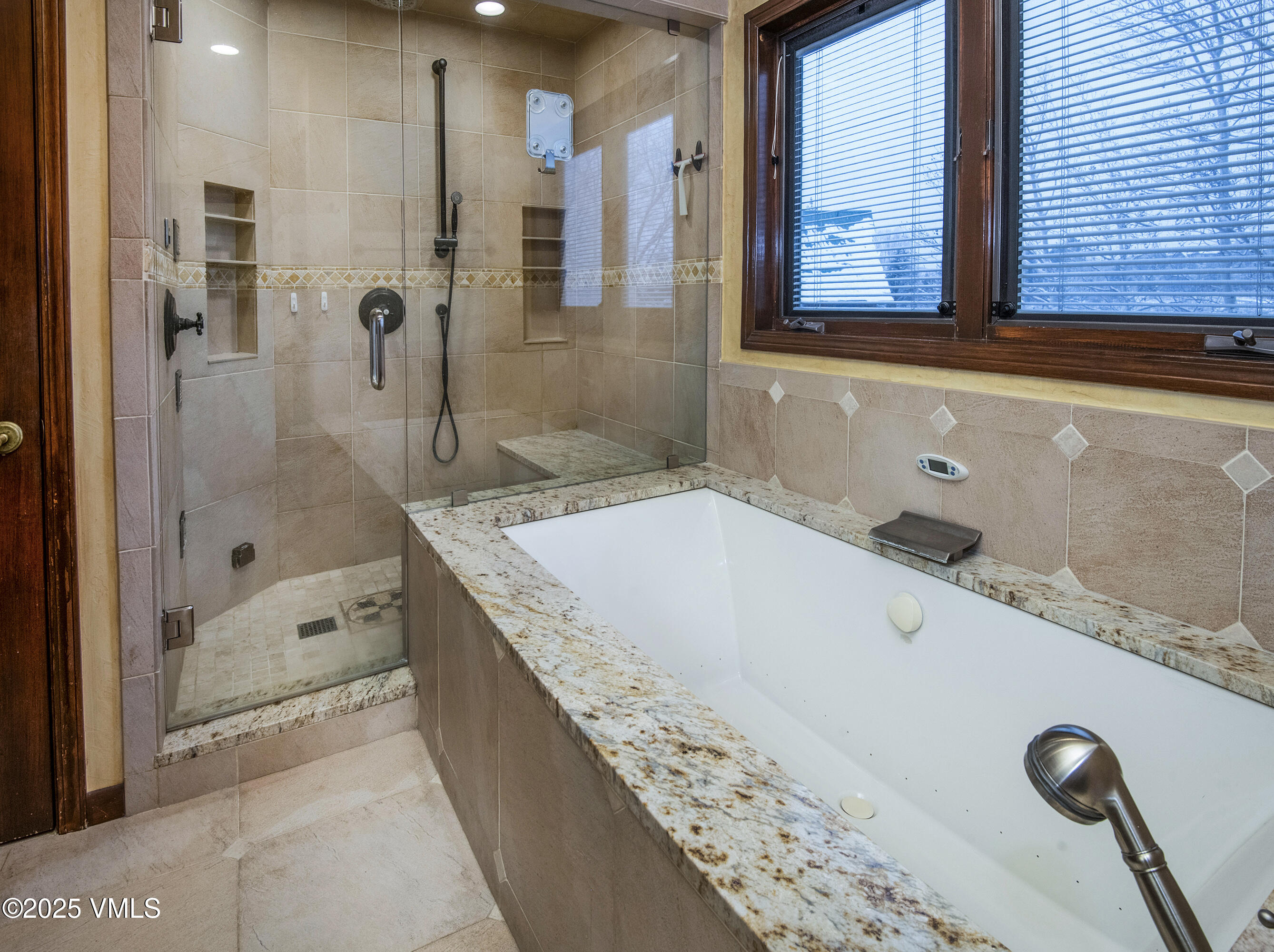 13 Pinion Lane Eagle, CO 81631 - Photo 19 of 60 a bathroom with a granite countertop tub sink and mirror