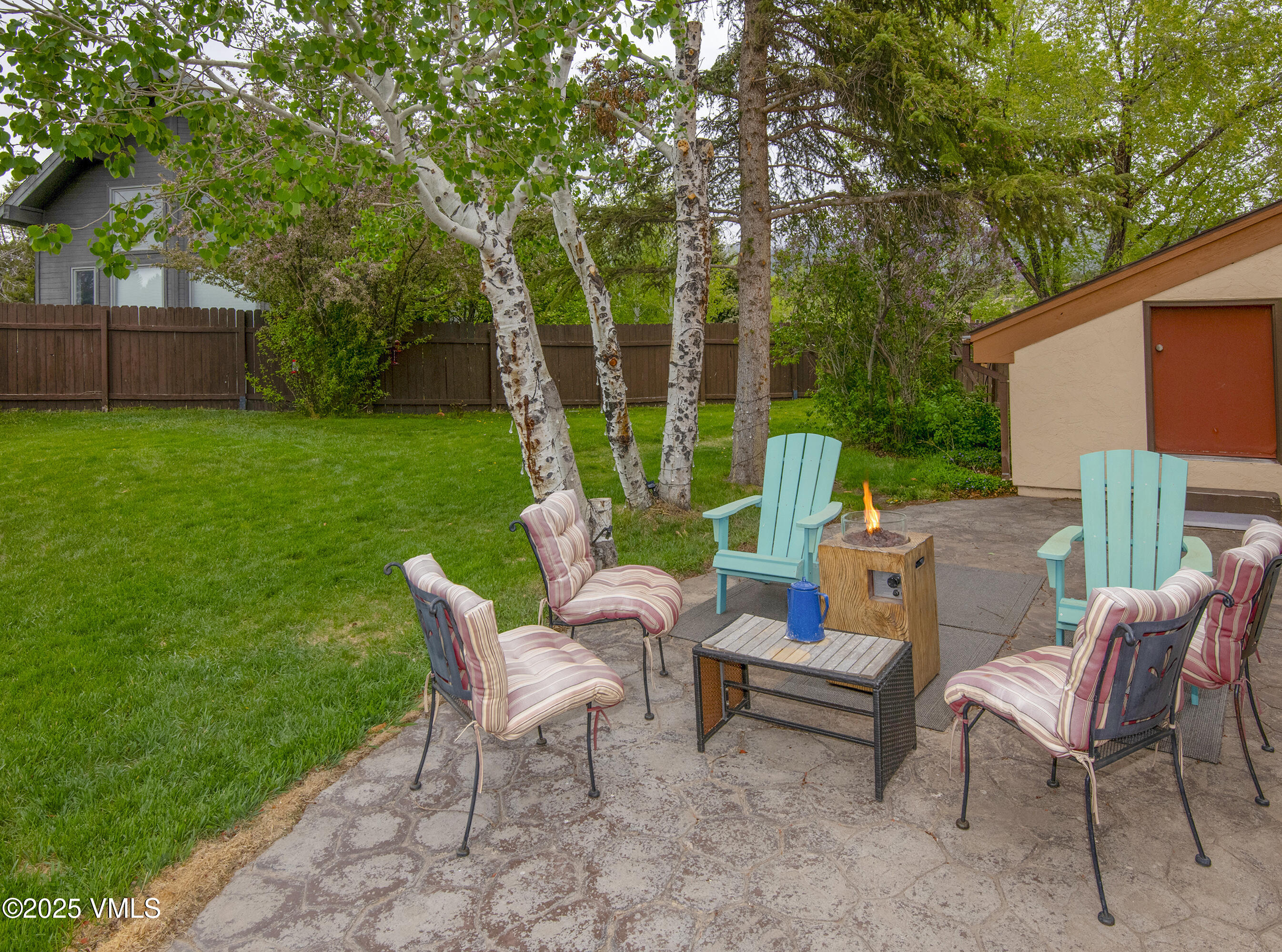13 Pinion Lane Eagle, CO 81631 - Photo 30 of 60 a view of a patio with a table chairs and a backyard