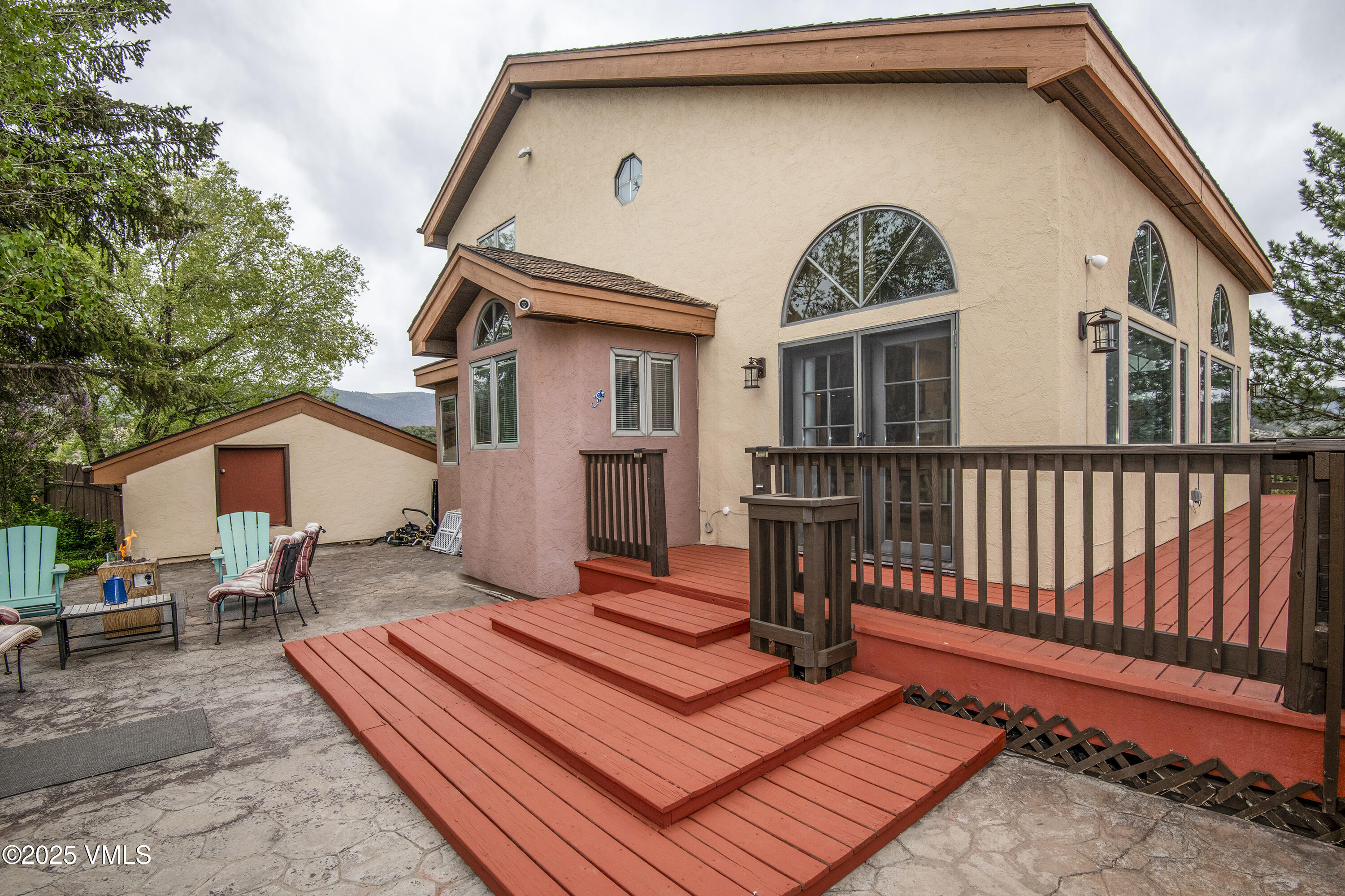 13 Pinion Lane Eagle, CO 81631 - Photo 31 of 60 a backyard of a house with table and chairs