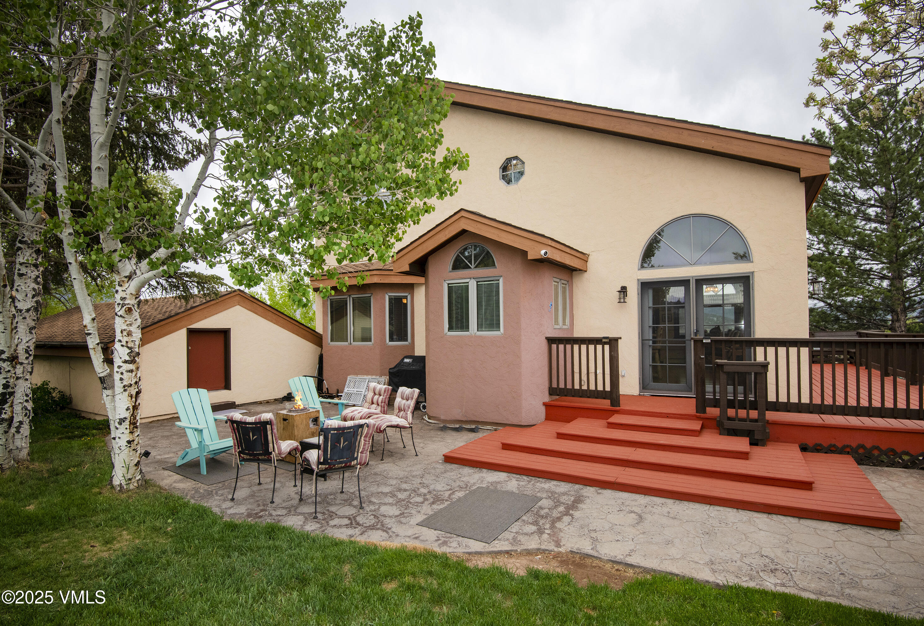 13 Pinion Lane Eagle, CO 81631 - Photo 32 of 60 a backyard of a house with table and chairs