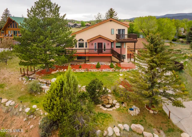 an aerial view of a houses with outdoor space
