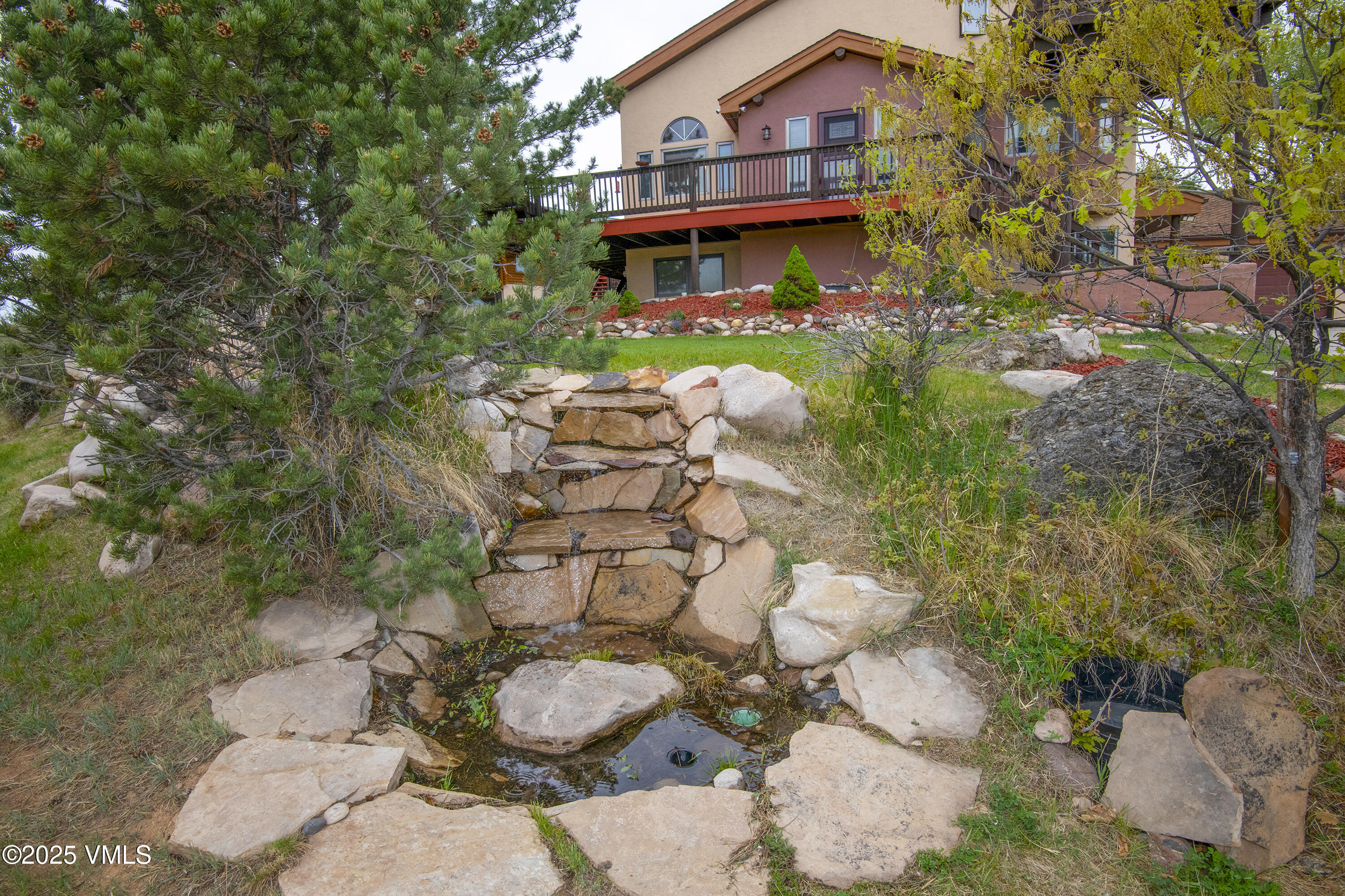 13 Pinion Lane Eagle, CO 81631 - Photo 51 of 60 a backyard of a house with lots of green space