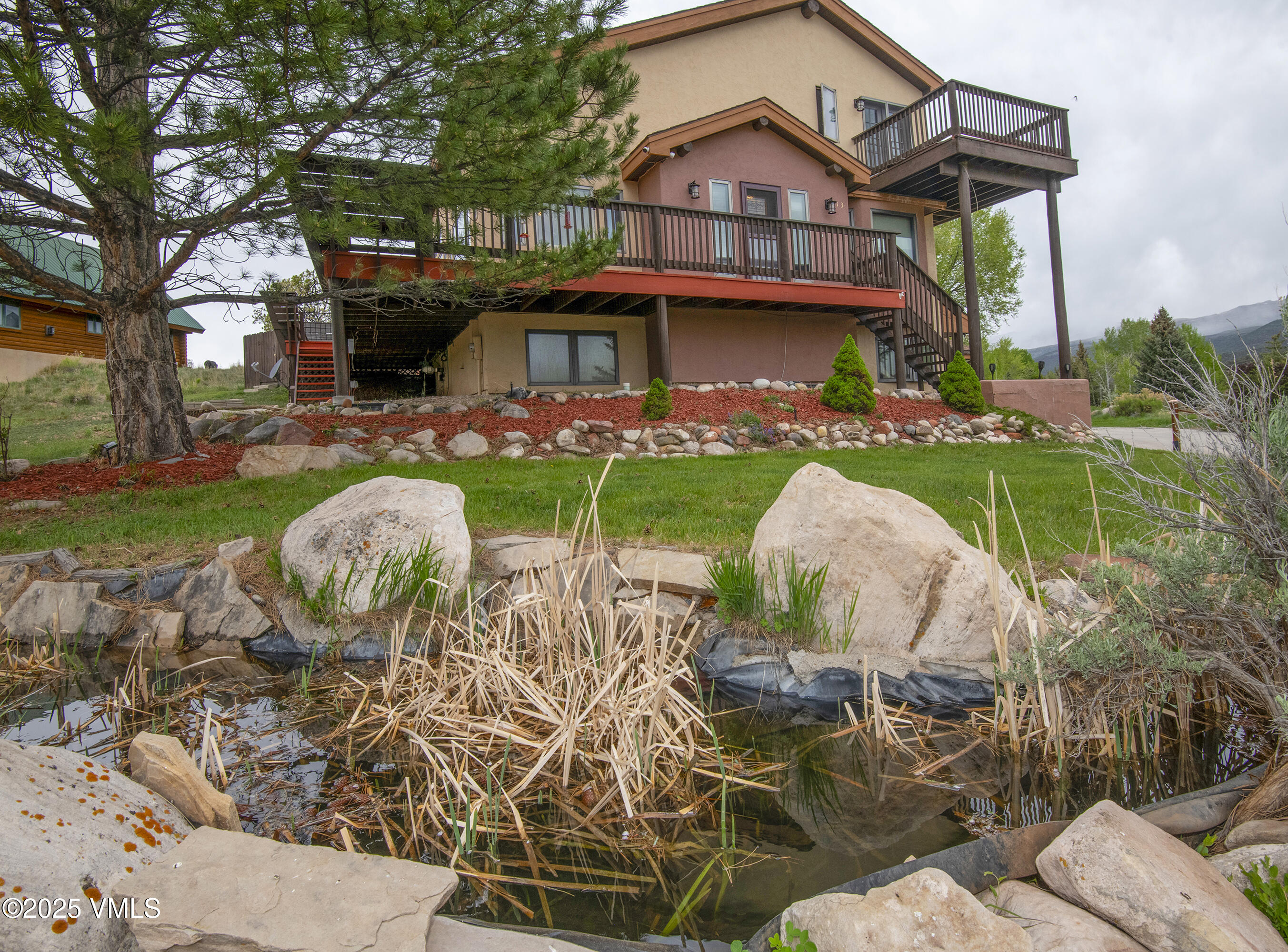 13 Pinion Lane Eagle, CO 81631 - Photo 52 of 60 a view of a chairs and table in the backyard