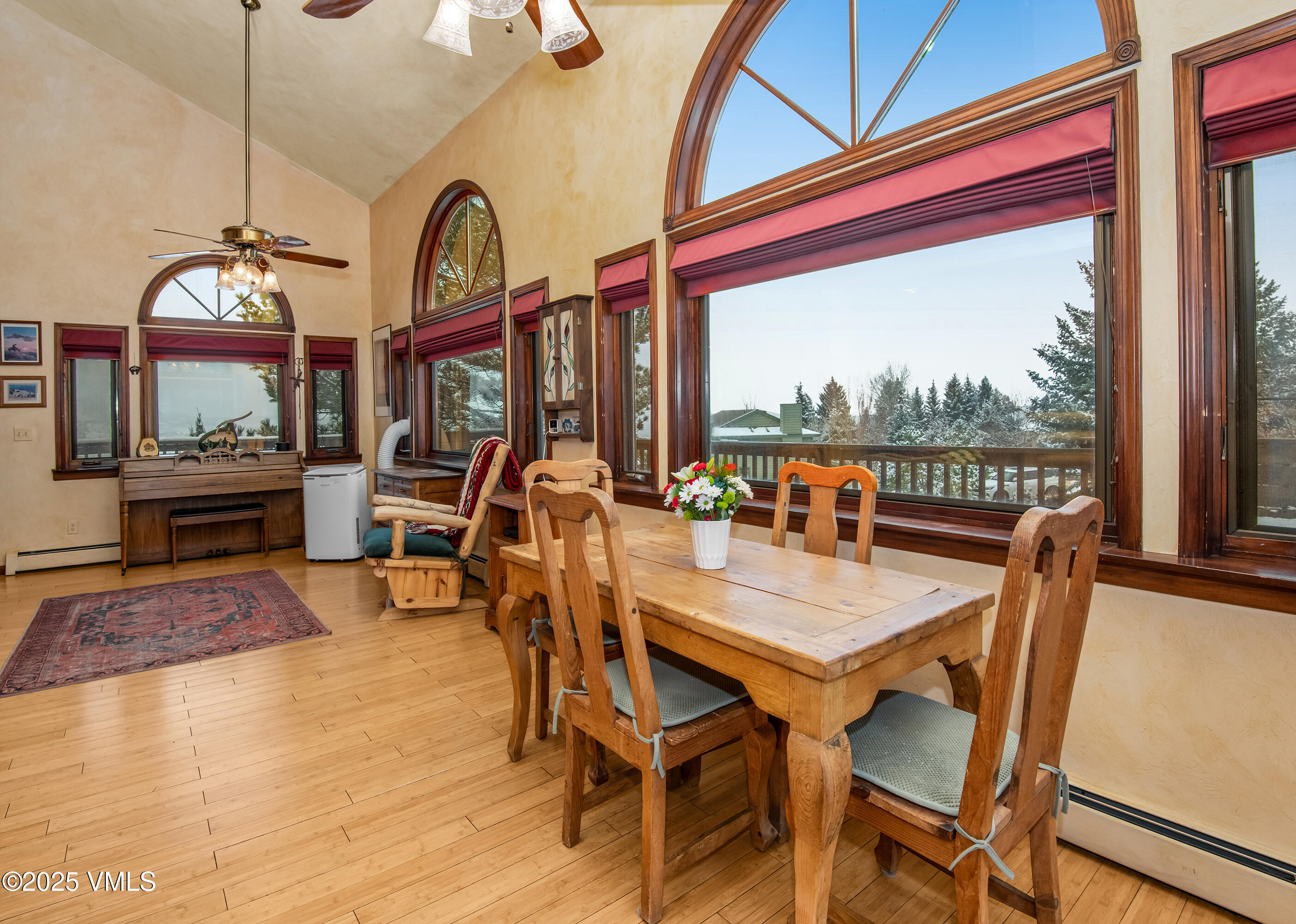 13 Pinion Lane Eagle, CO 81631 - Photo 8 of 60 a view of a dining room with furniture a chandelier and wooden floor
