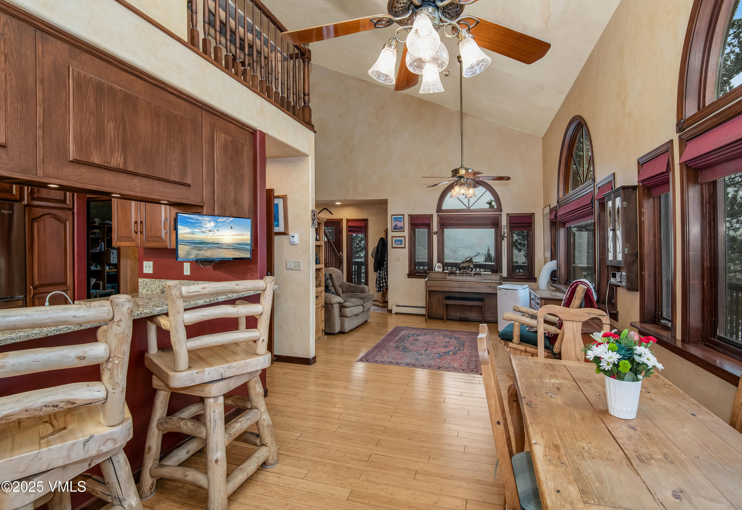 13 Pinion Lane Eagle, CO 81631 - Photo 9 of 60 a living room with furniture a fireplace and a chandelier