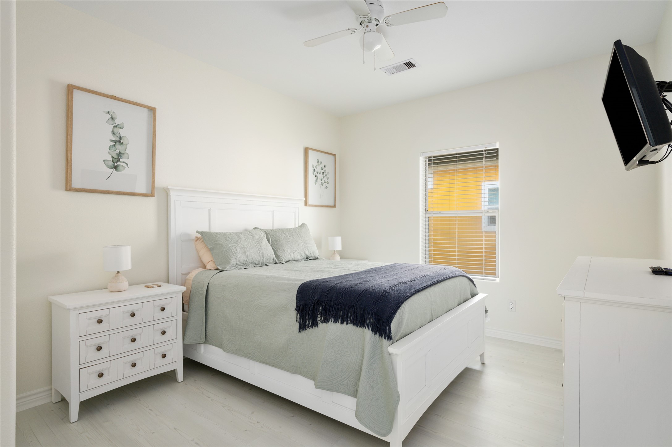 963 James Road Port Bolivar, TX 77650 - Photo 32 of 47 The first guest bedroom comfortably accommodates a queen-size bed, offering a cozy and inviting space for guests.