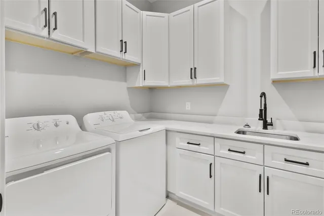 a large kitchen with a table and chairs