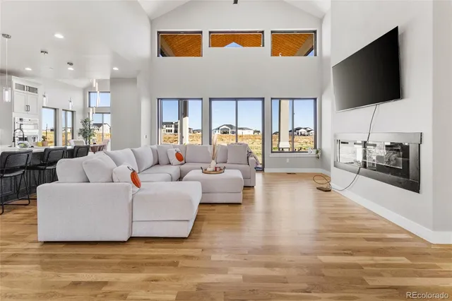 a living room with fireplace furniture and a flat screen tv