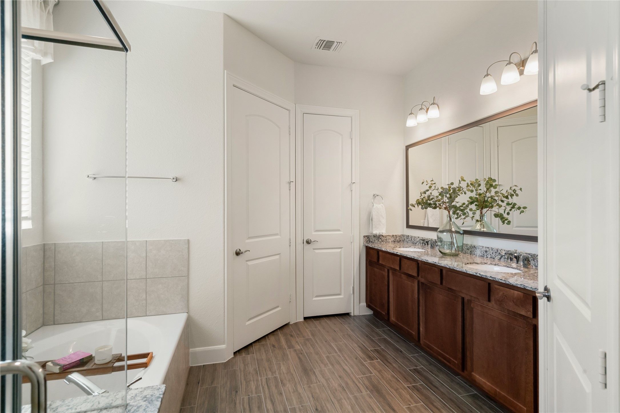 516 Nokota Drive Spring, TX 77382 - Photo 18 of 33 Primary bath has both walk-in shower and soaking tub. This is also considered an upgrade to the Martin Ray series. Enjoy a nice soak after a competitive game of pickleball or tennis.