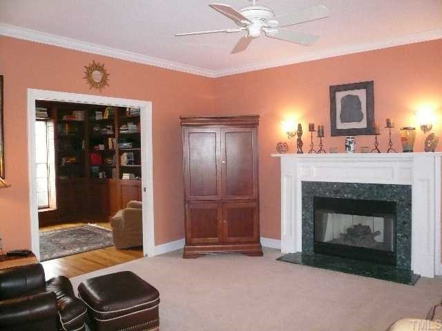 5908 Orchid Valley Road Raleigh, NC 27613 - Photo 2 of 12 a living room with furniture and a fireplace