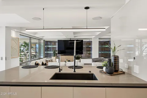 a view of a living room and kitchen floor