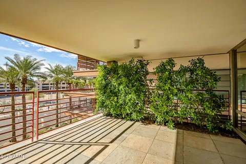 a view of balcony with furniture