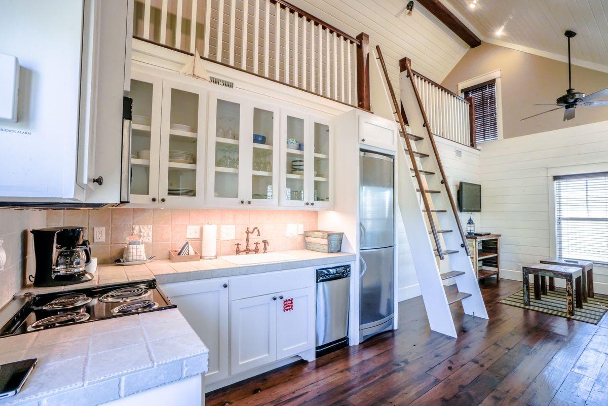 155 Bluejack Street Santa Rosa Beach, FL 32459 - Photo 20 of 28 a kitchen with a sink a stove and cabinets