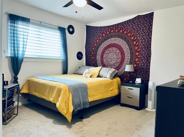 a bedroom with a bed and a table