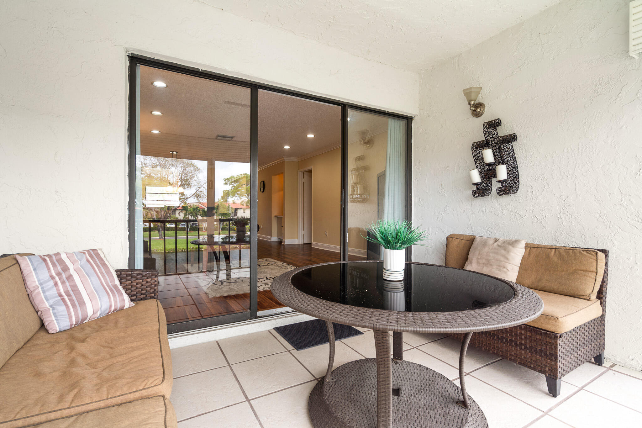 21218 Lago Circle, Unit H Boca Raton, FL 33433 - Photo 34 of 43 a living room with furniture and a potted plant