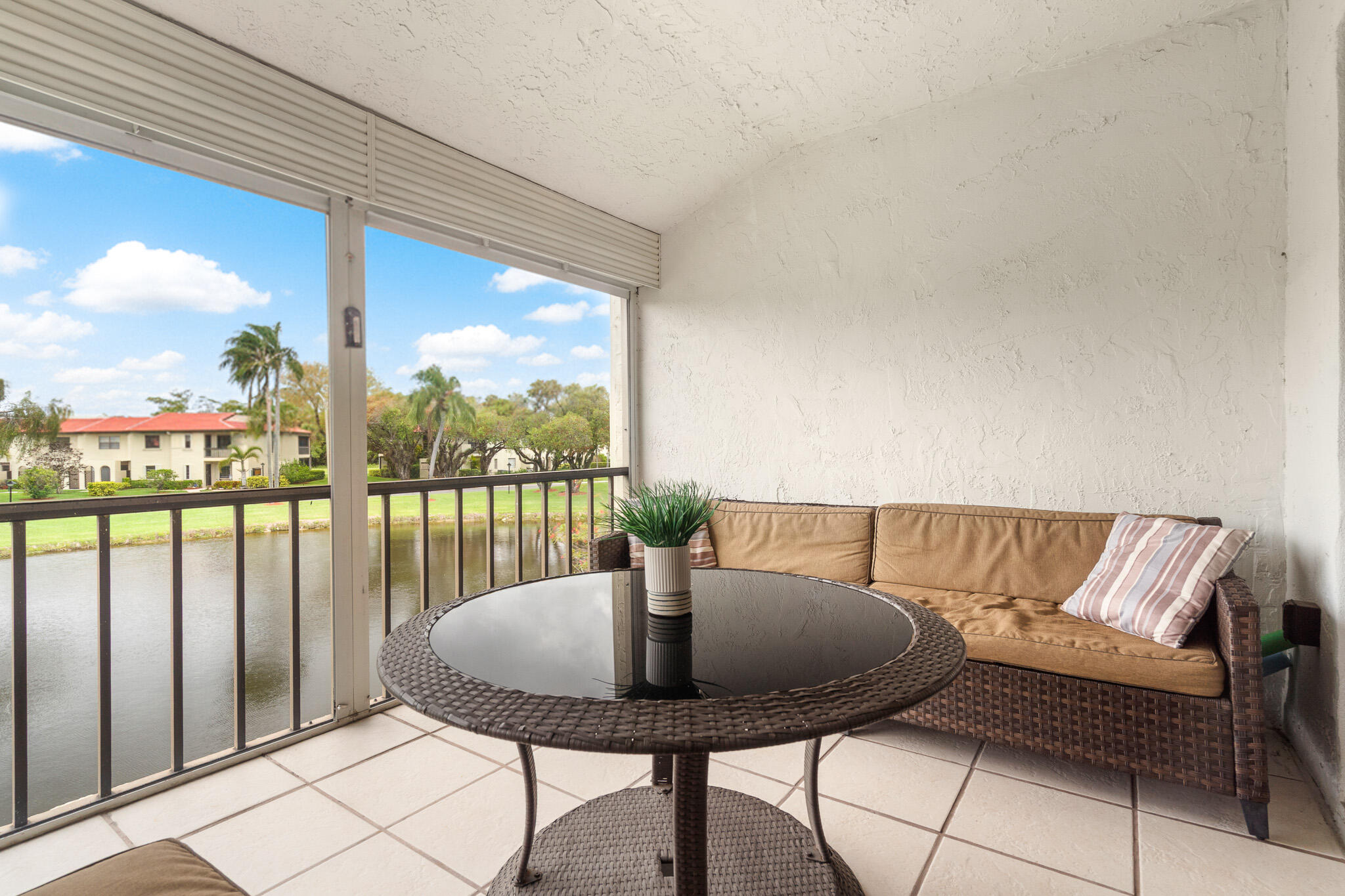 21218 Lago Circle, Unit H Boca Raton, FL 33433 - Photo 35 of 43 a view of a chairs and table in patio