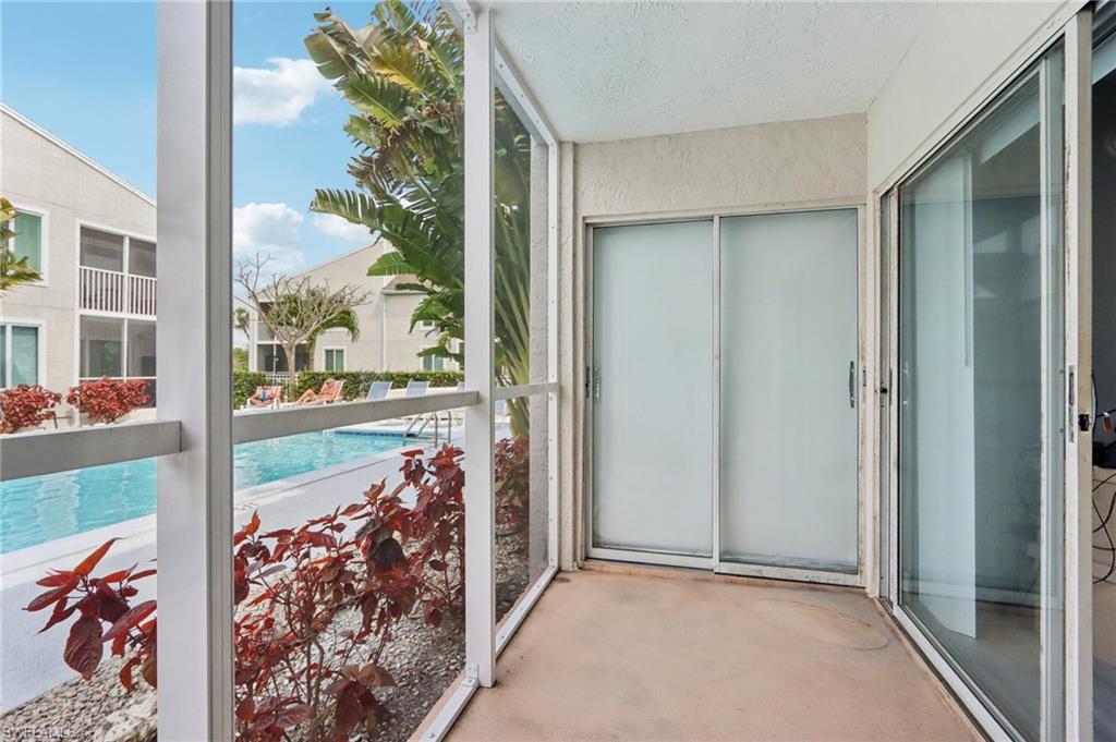 2185 San Marco Road, Unit 3103 Marco Island, FL 34145 - Photo 16 of 22 an empty room with large windows