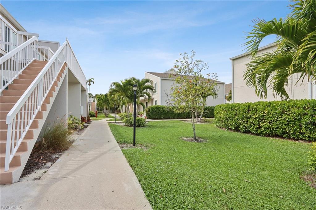 2185 San Marco Road, Unit 3103 Marco Island, FL 34145 - Photo 18 of 22 a view of a house with a yard