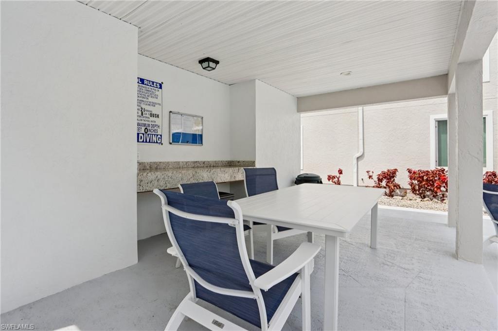 2185 San Marco Road, Unit 3103 Marco Island, FL 34145 - Photo 21 of 22 a view of a dining room with furniture