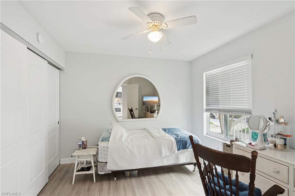 2185 San Marco Road, Unit 3103 Marco Island, FL 34145 - Photo 8 of 22 a bedroom with a bed a table and chair