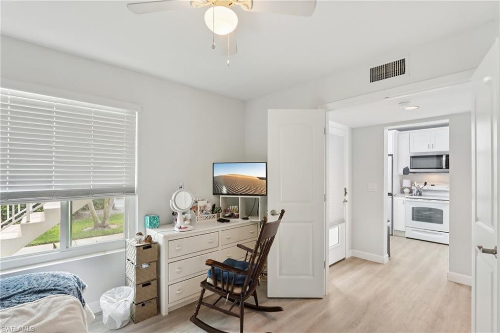 2185 San Marco Road, Unit 3103 Marco Island, FL 34145 - Photo 9 of 22 a view of a workspace with furniture and a window