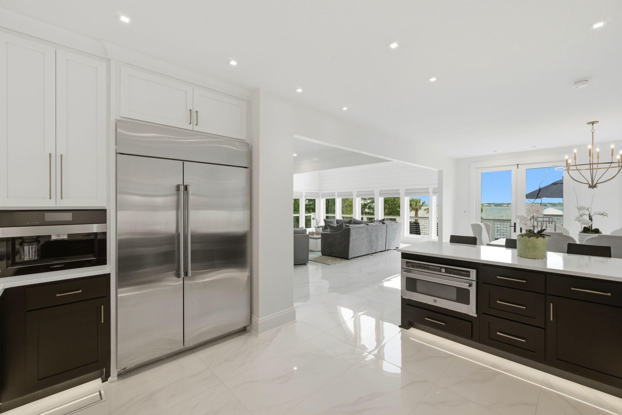31061 Peninsula Drive Orange Beach, AL 36561 - Photo 47 of 93 a kitchen with stainless steel appliances kitchen island granite countertop a refrigerator and a sink