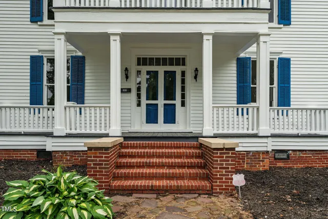 a view of balcony with wooden floor