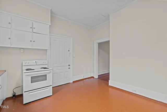 a kitchen that has a sink and a stove